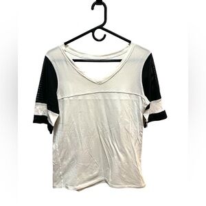 LULULEMON BLACK AND CREAM MESH SLEEVE JERSEY STYLE TOP